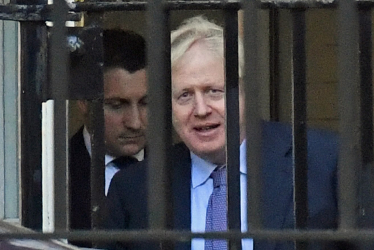 Boris Johnson prepares to leave Downing Street on his way to the European Council Summit on Thursday. 