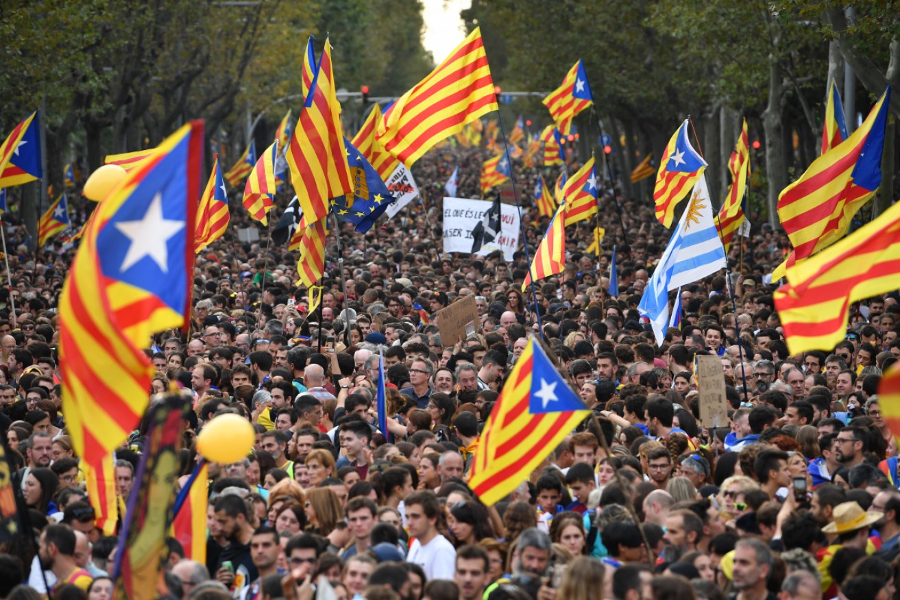 More than half-a-million people flooded the streets of Barcelona to protest jail terms for separatist leaders.