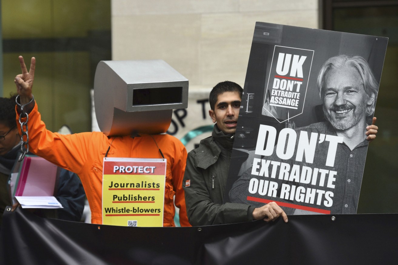 Supporters of WikiLeaks founder Julian Assange demonstrate outside Westminster Magistrates' Court in London on Monday.