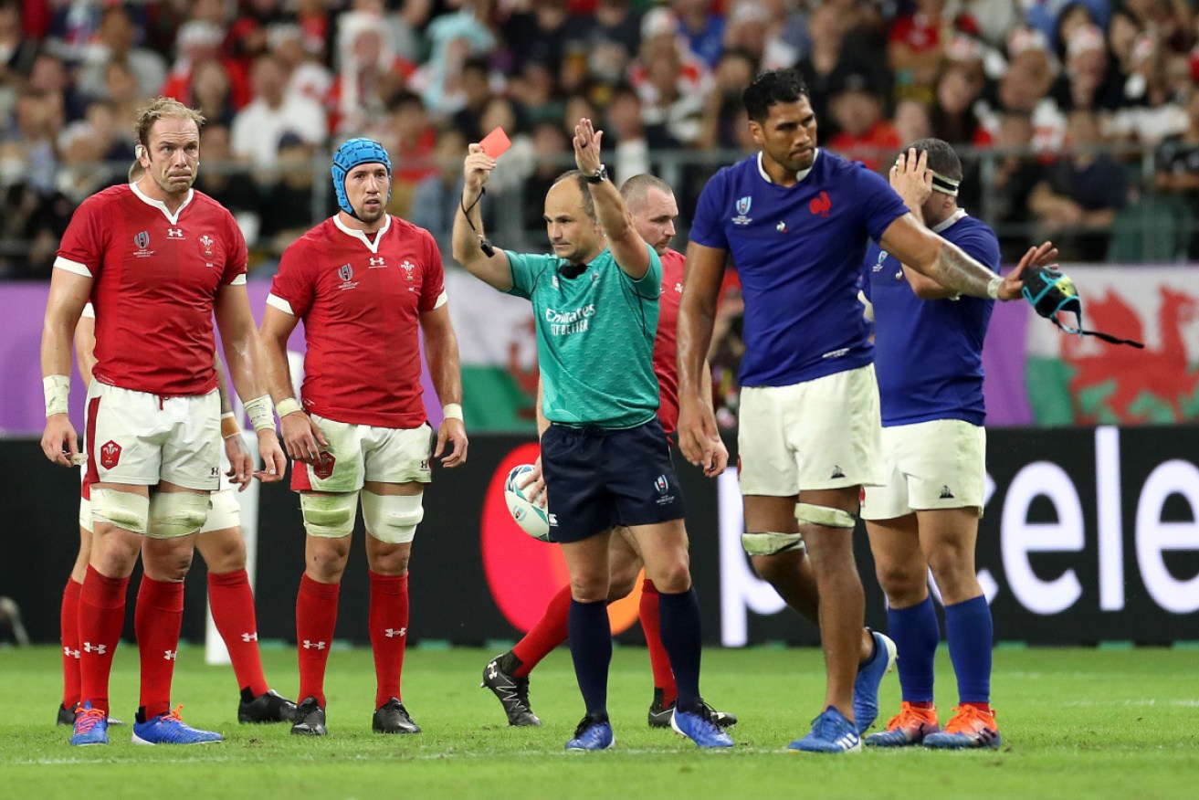 Sebastien Vahaamahina of France receives a red card from referee Jaco Peyper during the match between Wales and France.