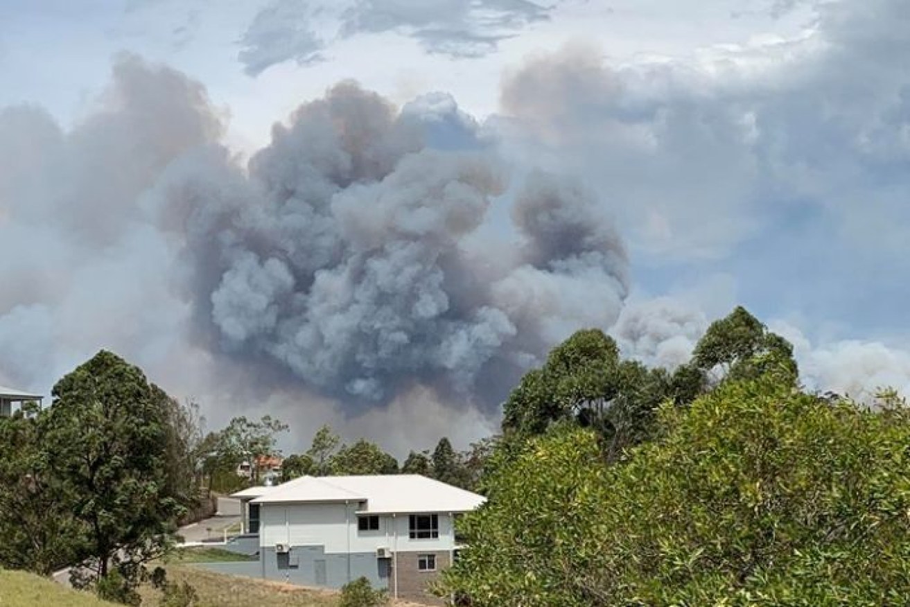 The fire near Darawank was threatening homes on Saturday afternoon.