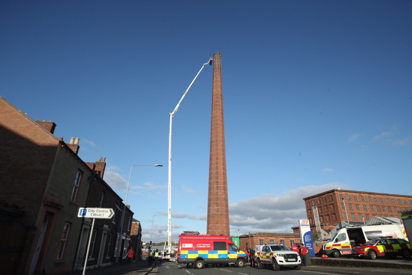 Rescuers used a scissor lift to try to reach the man at the top of Dixons Chimney.
