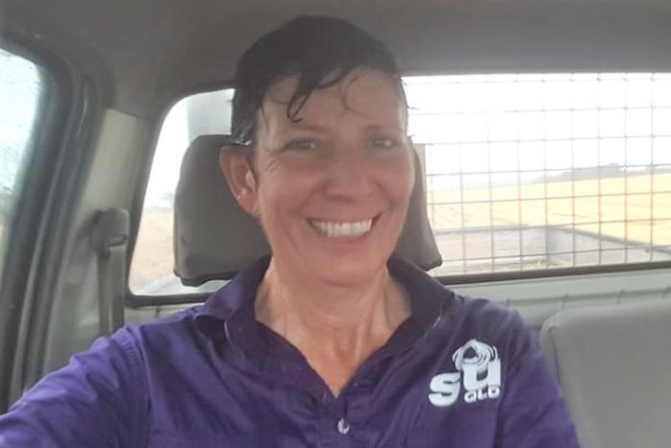 Trina Patterson from Rolleston in central Queensland says she was playing in the rain like a "big, happy kid".