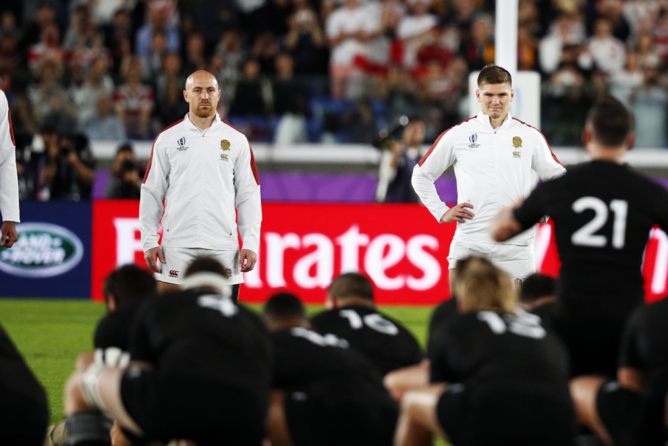 England players, including Owen Farrell (right) face up to the New Zealand haka before the World Cup semi-final match.