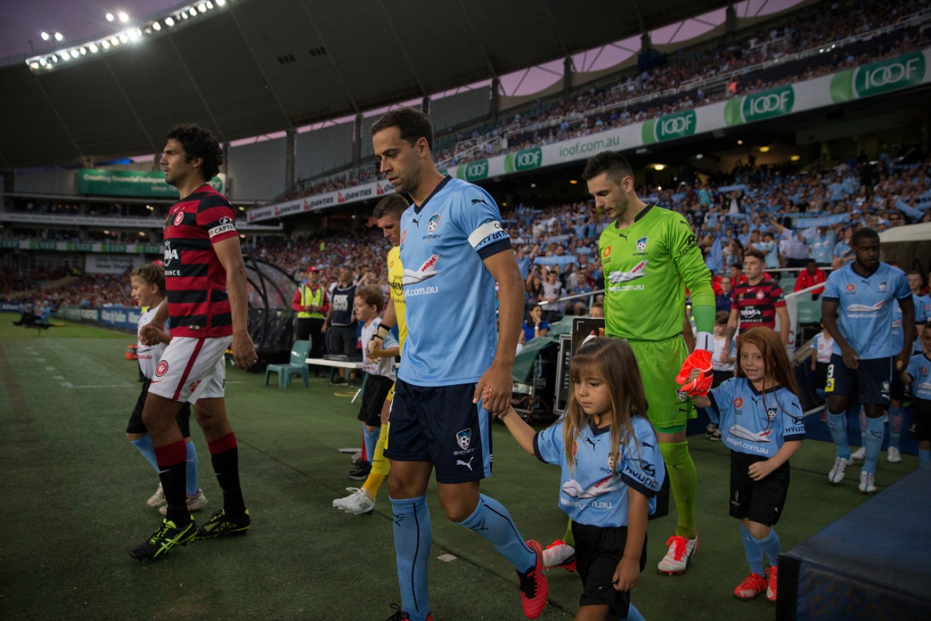 The teams walk out onto the field before the Sydney derby.