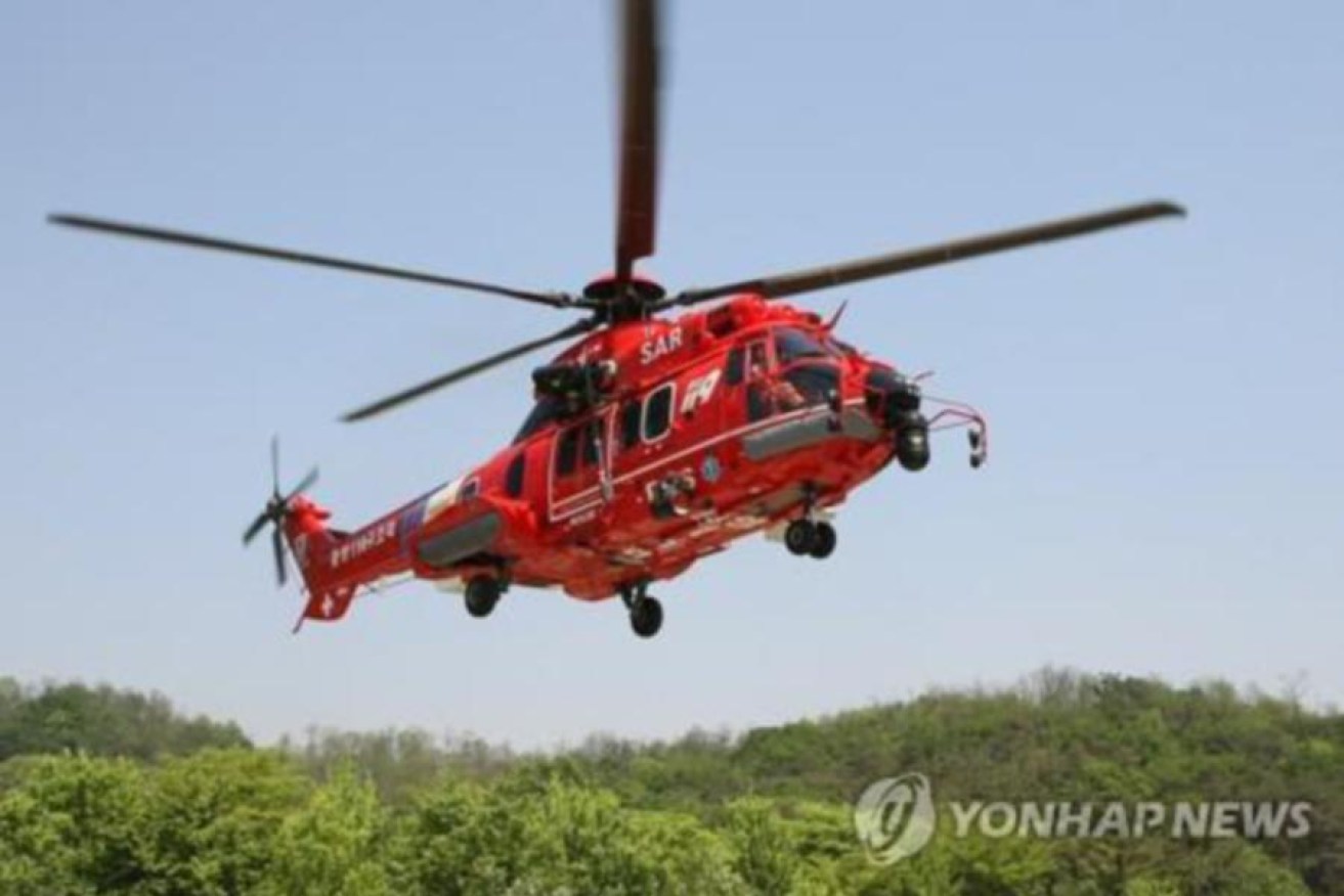 Yonhap News says an injured man from a fishing boat, a friend and five rescuers were on board.