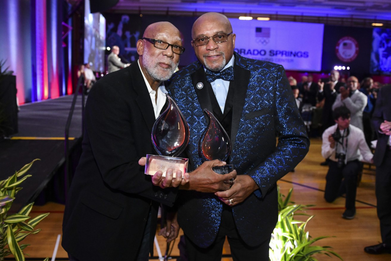 John Carlos (L) and Tommie Smith after being inducted into the US Olympic Hall of Fame.