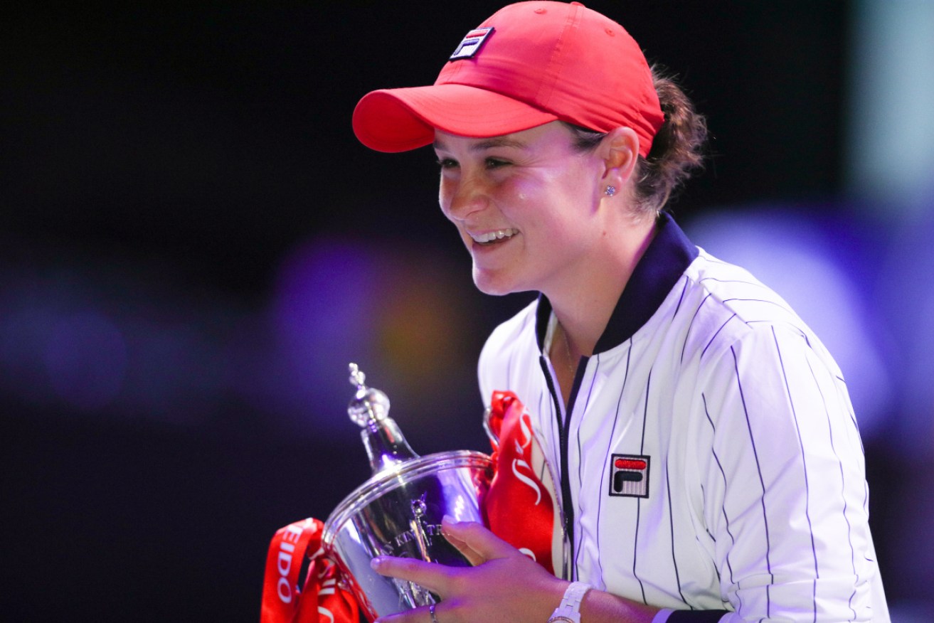 An era of equality: Ashleigh Barty with the spoils of victory. 