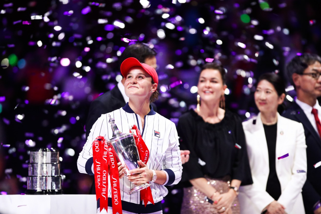 Champion Ashleigh Barty celebrates with the trophy after winning the Women's Singles final match against Elina Svitolina of Ukraine on Day eight of the 2019 WTA Finals.