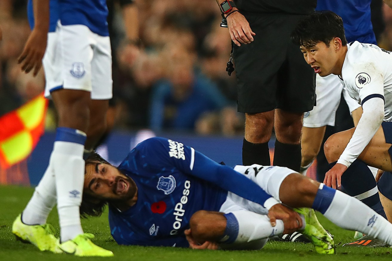 Son Heung-min of Tottenham Hotspur looks on in horror after a tackle on Andre Gomes of Everton which resulted in a red card.