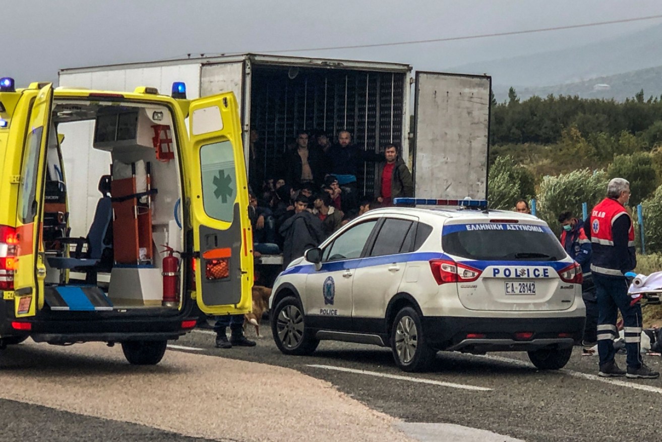 Emergency services attend to 41 migrants who were found alive in a refrigerated truck near Xanthi, northern Greece.