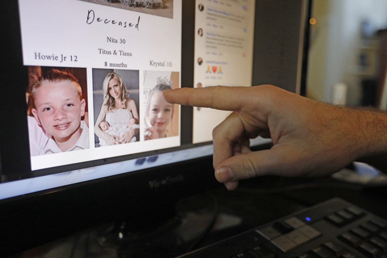 Austin Cloes points to a photo of relatives Rhonita Miller and her family.