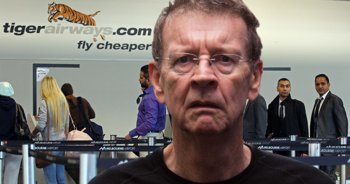 Red Symons needs help to tackle Tiger after getting stuck in Canberra
