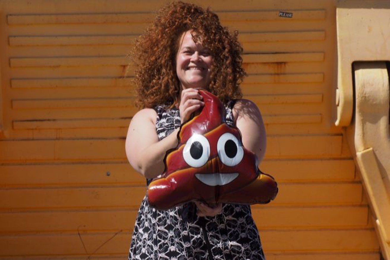 Kalgoorlie-Boulder resident Sarah Hinton holds a 'poo balloon', the symbol of the competition.
