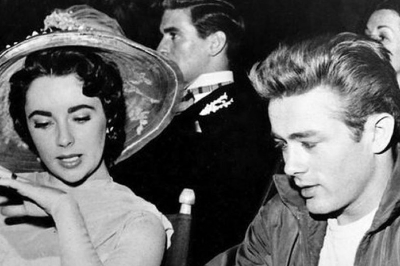 James Dean with Elizabeth Taylor, his co-star in 1956's <i>Giant</i>, completed after his death.
