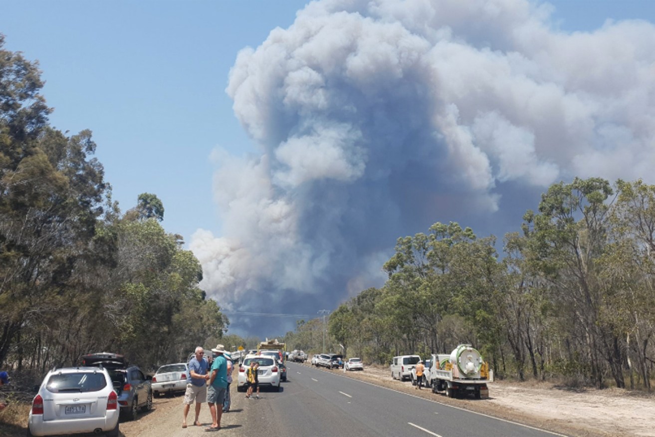 Residents at Walkers Point, near Bundaberg, were urged to evacuate as a large fire approached.