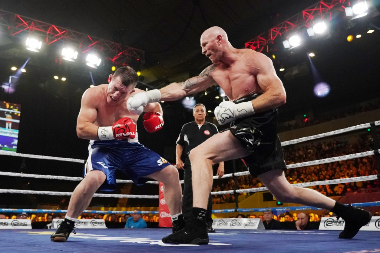 Paul Gallen and Barry Hall during their short, drawn bout. 
