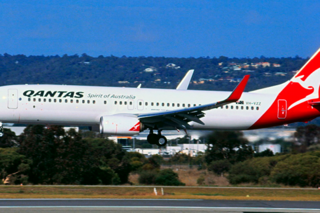 Qantas says it won't fly overseas, except a handful of flights to New Zealand, until at least October.