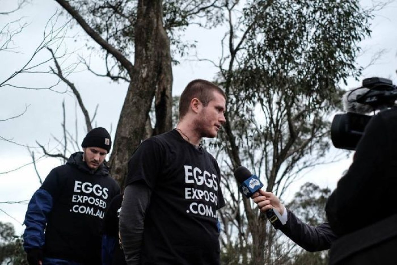 Aussie Farms chief Chris Delforce speaks to media at a protest.