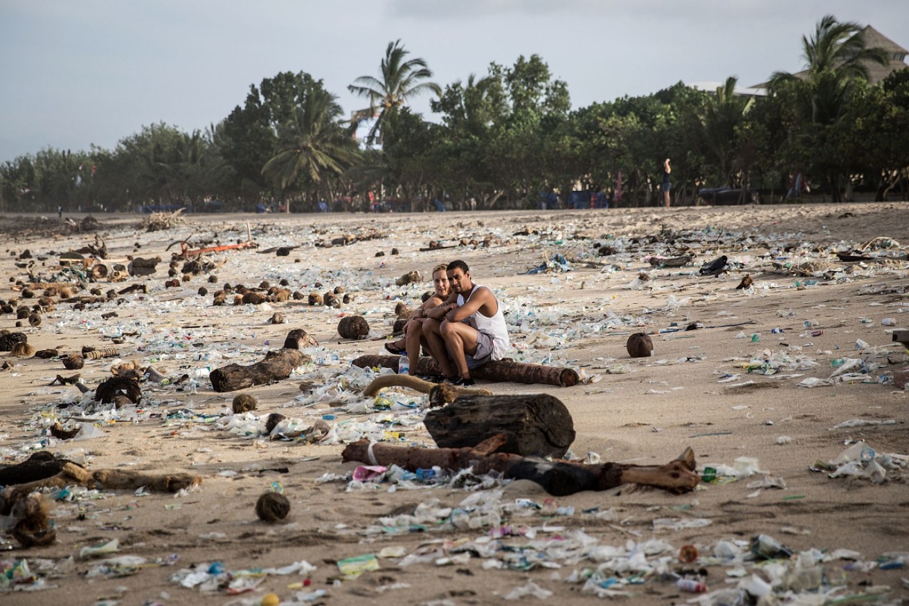 Rubbish and plastic is strewn along Bali's Kuta beach, a favourite among tourists.