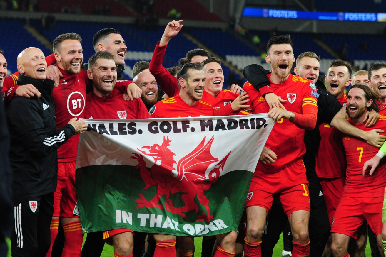 Wales players celebrate qualification for Euro 2020 after their victory over Hungary.
