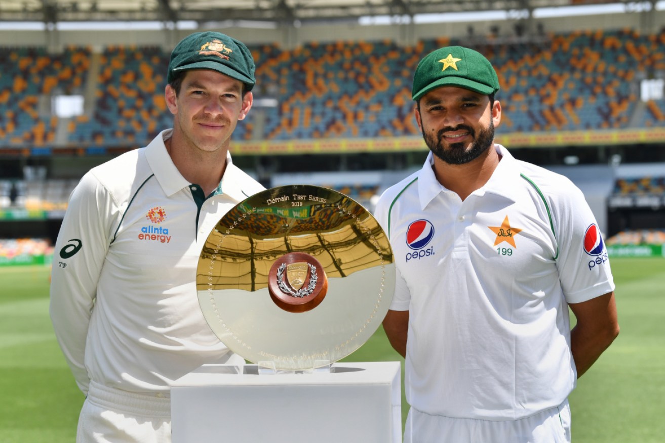 Australian skipper Tim Paine (L) and Pakistan's Azhar Ali with the spoils of the Test series.