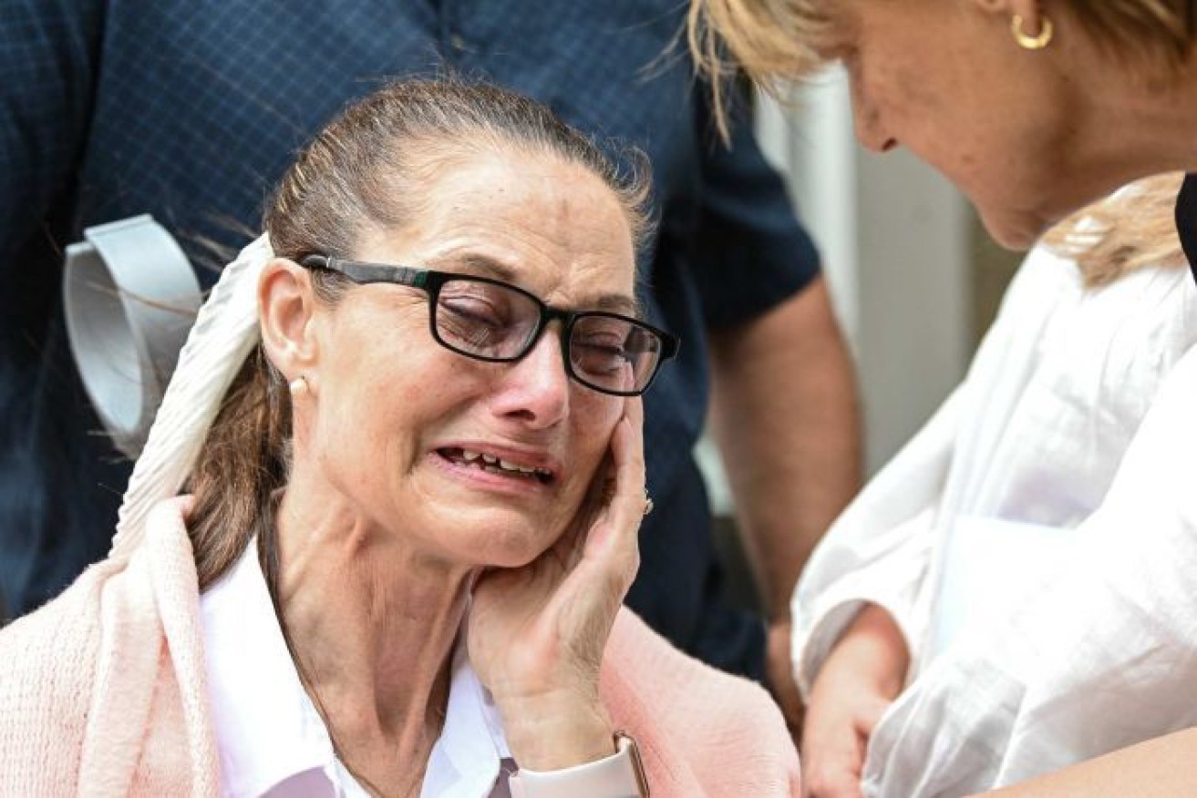 One of the women involved in the class action outside court on Thursday.