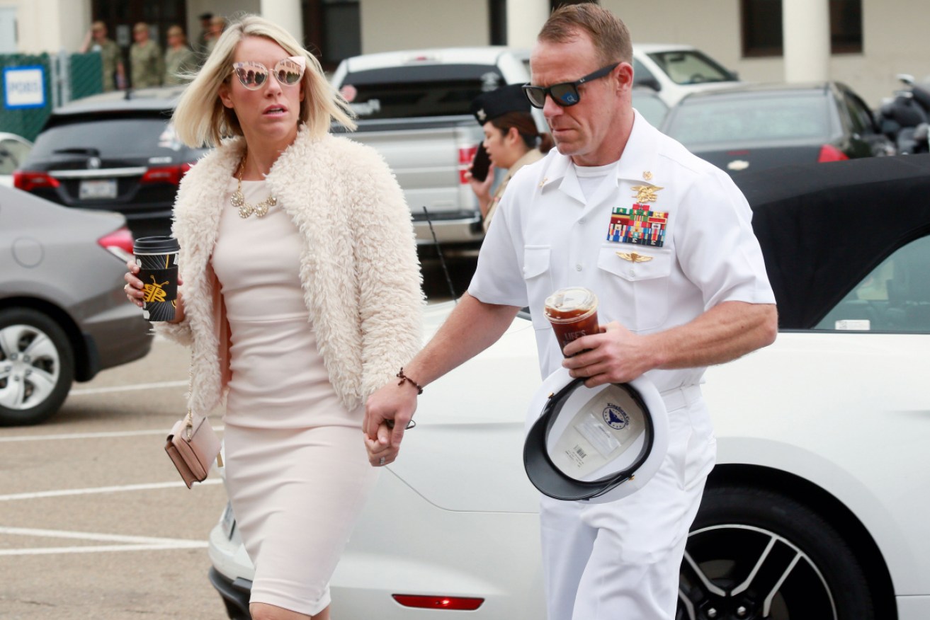 Edward Gallagher walks into military court with his wife.