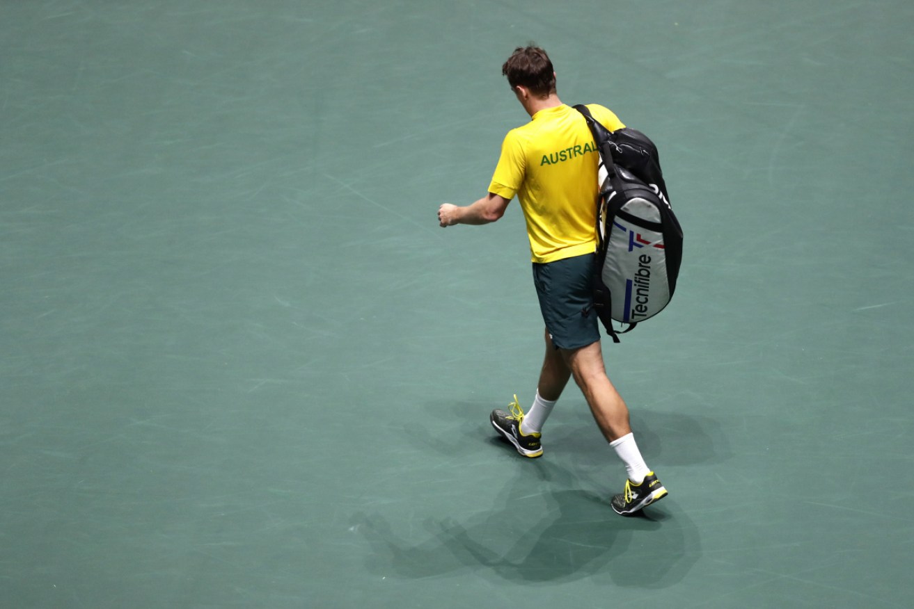 A devastated John Millman leaves  the court after his Davis Cup defeat in Madrid, Spain. 
