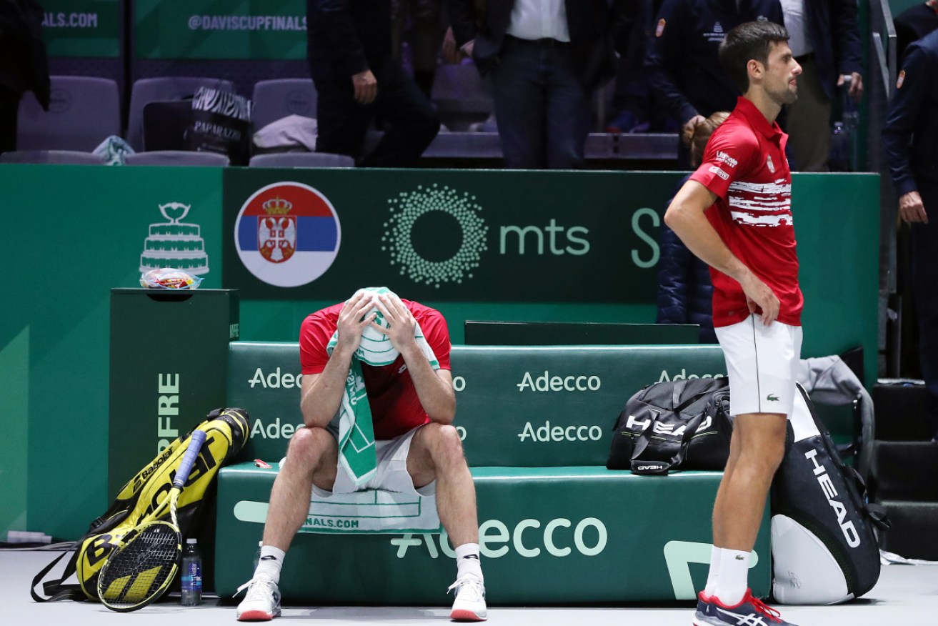 Serbia's Novak Djokovic and teammate Viktor Troicki (left) distraught after losing to Russia.
