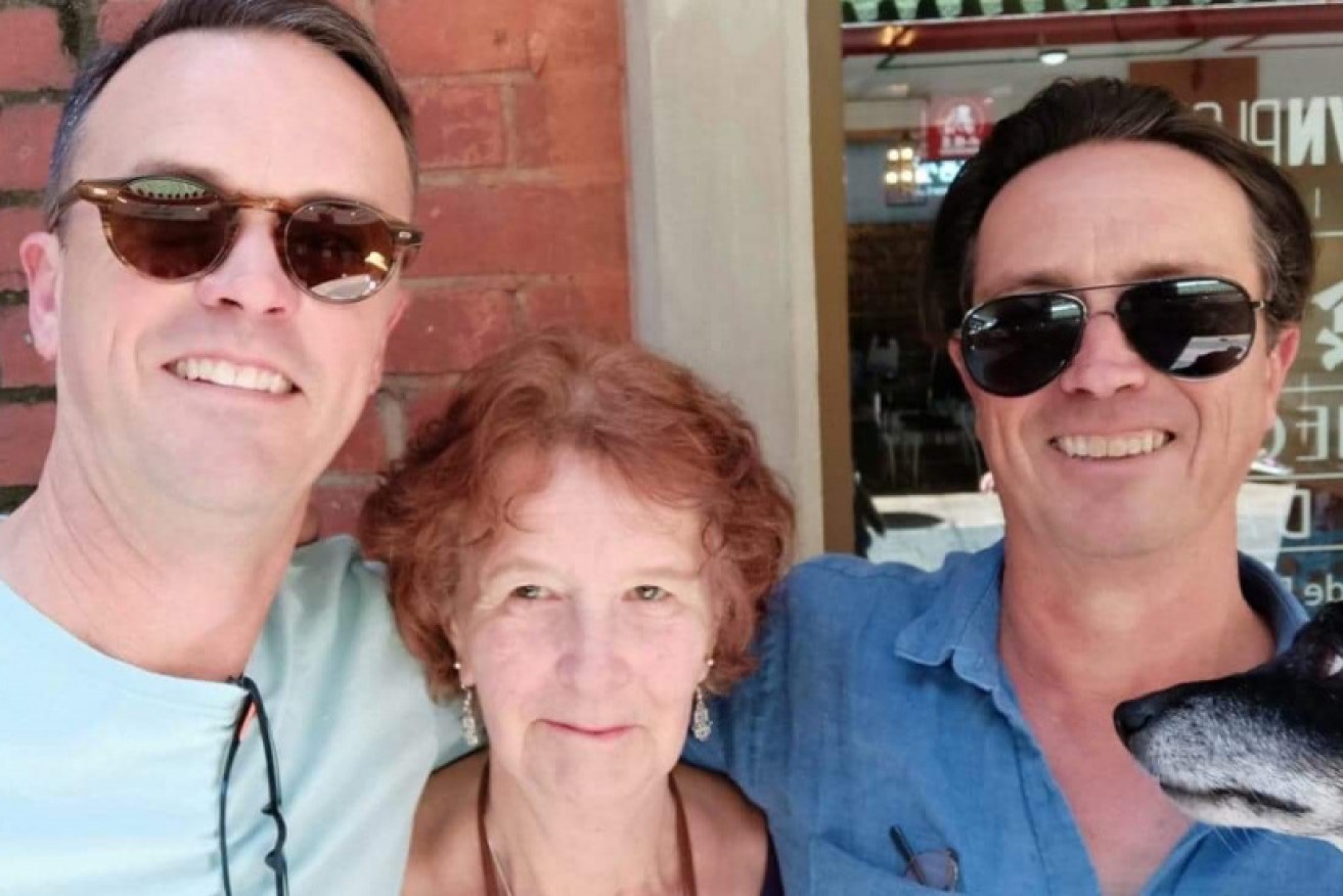 Pat Isaacs (with her sons Gary and Damon) dropped her private health cover after realising she had to pay $6000 for knee surgery.