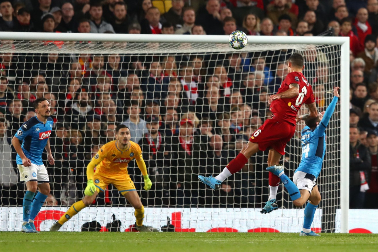 Dejan Lovren scores Liverpool's equaliser against Napoli.