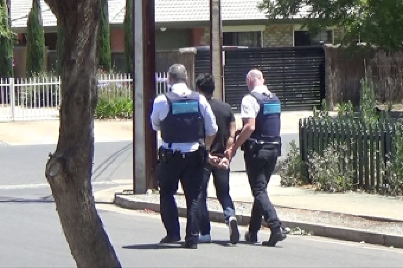 The 25-year-old man was arrested at a home in Adelaide's inner-city area on Wednesday.