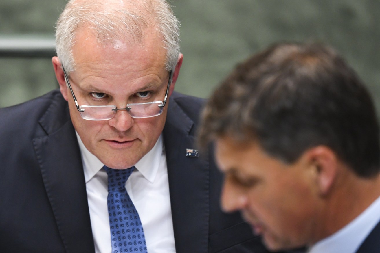 Prime Minister Scott Morrison listens to  Energy Minister Angus Taylor on Thursday.