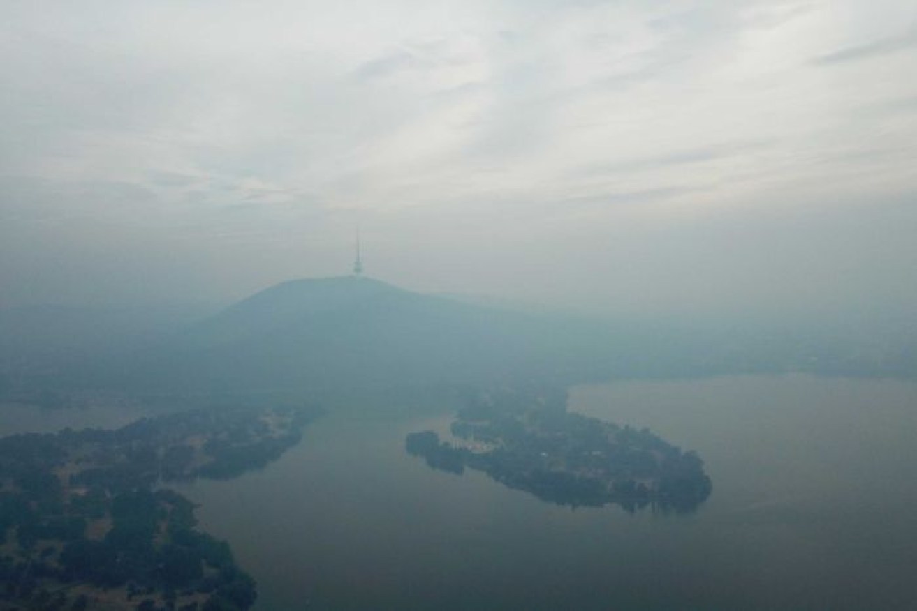 Canberra was obscured by smoke on Friday as fires burned in NSW.