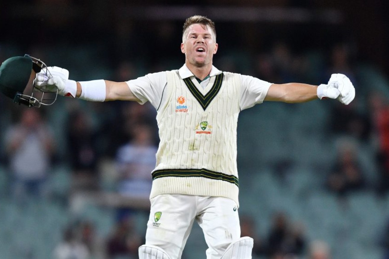 David Warner celebrates his century at the Adelaide Oval on Friday evening. 