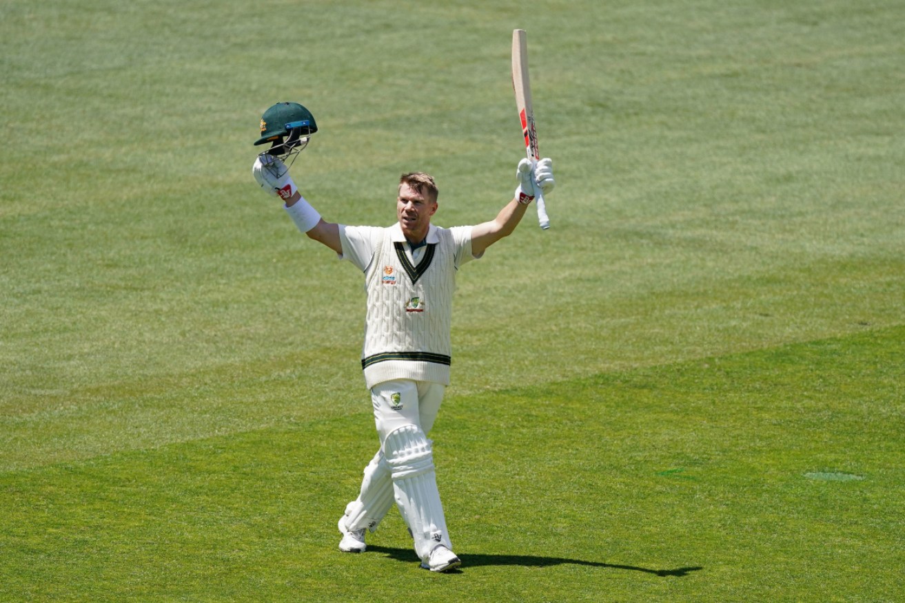 David Warner celebrates with his trademark leap and kiss of the helmet after scoring his second Test double century.