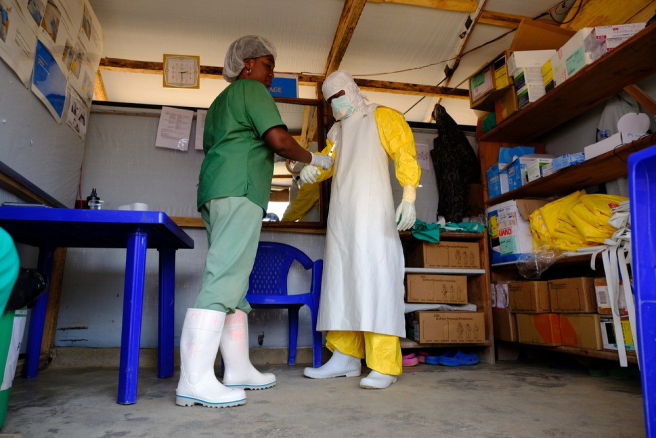 A staff member prepares to enter the high-risk zone at the Ebola Treatment Centre in Beni. 