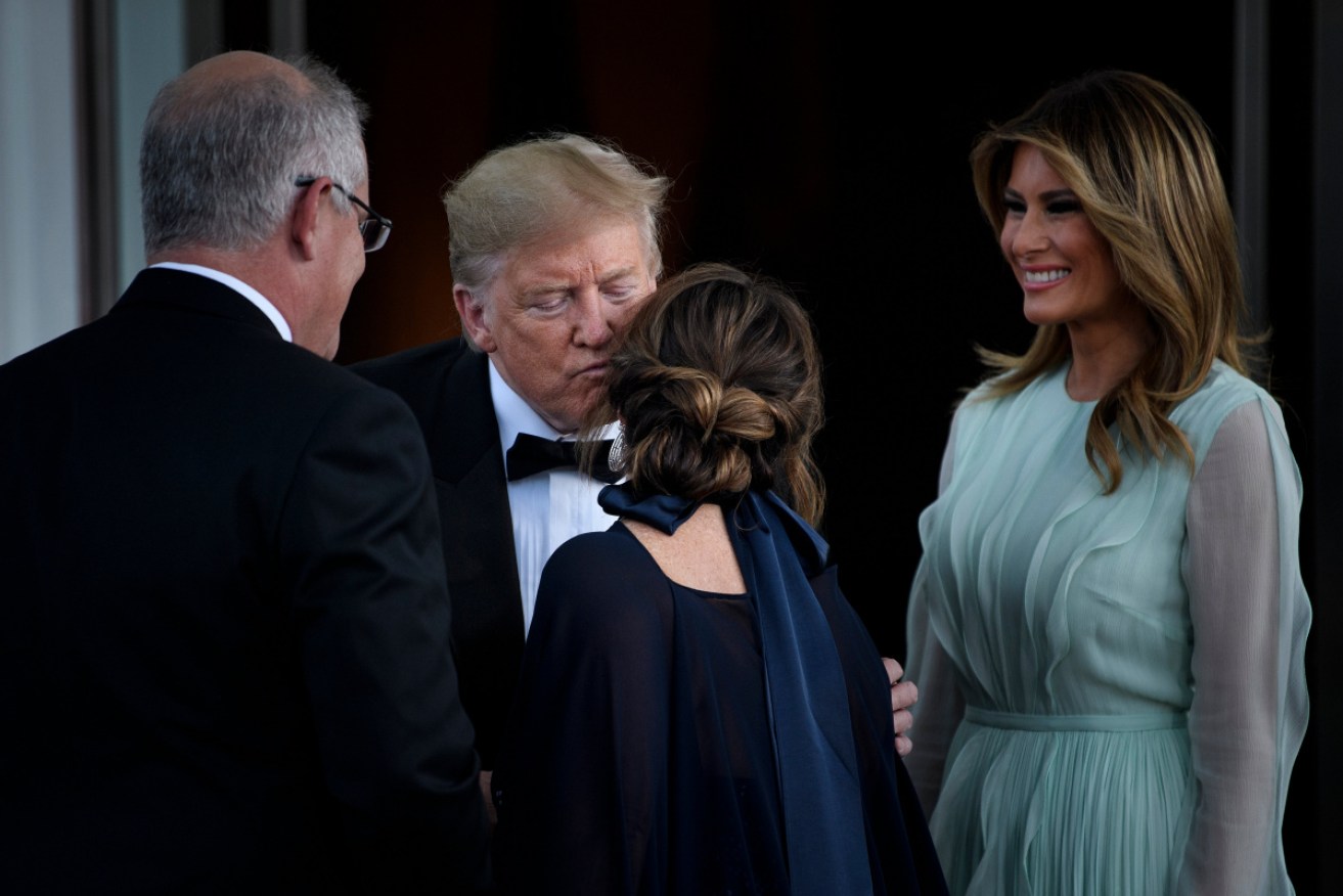 Scott and Jenny Morrison are greeted by the Trumps ahead of the White House dinner in September.