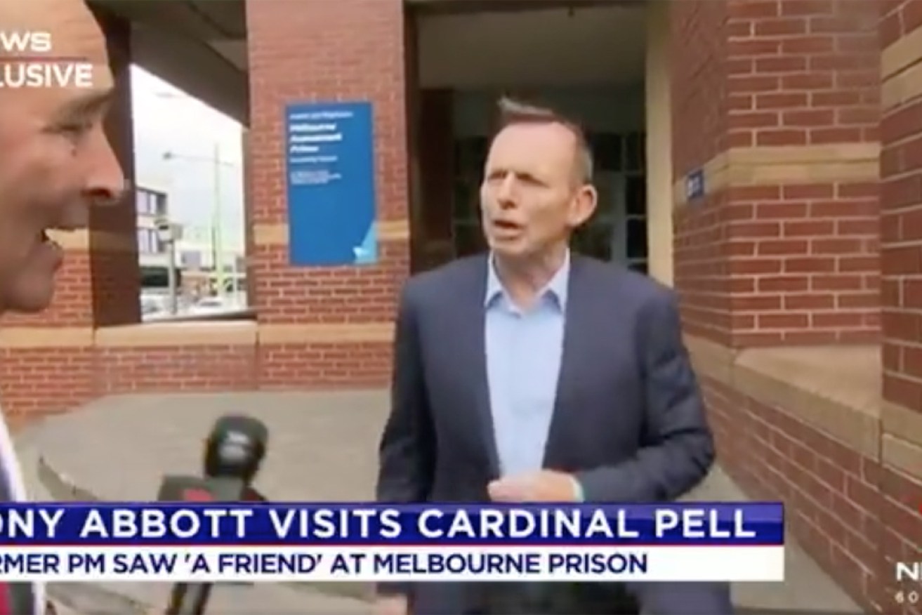 Seven reporter Brendan Donohoe asks Tony Abbott about his jail visit on Monday. 