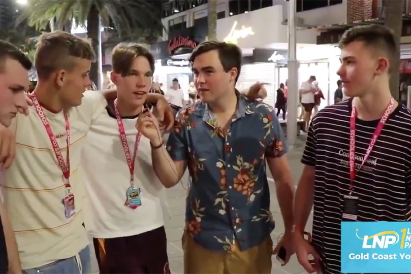 Gold Coast Young LNP chair Barclay McGain (in blue shirt) interviews schoolies in the footage.