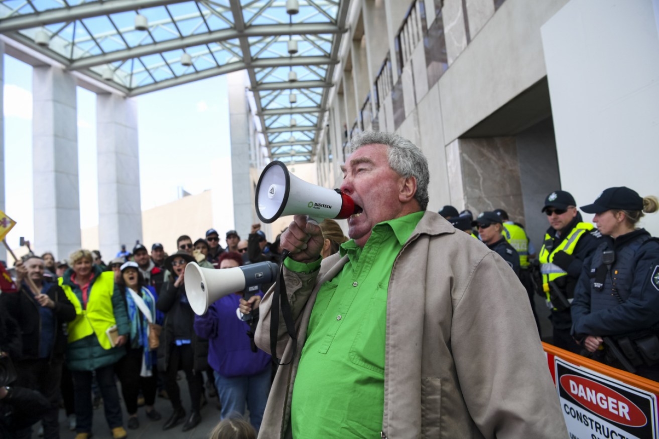 Farmers at the Convoy to Canberra protest at Parliament House on Monday.