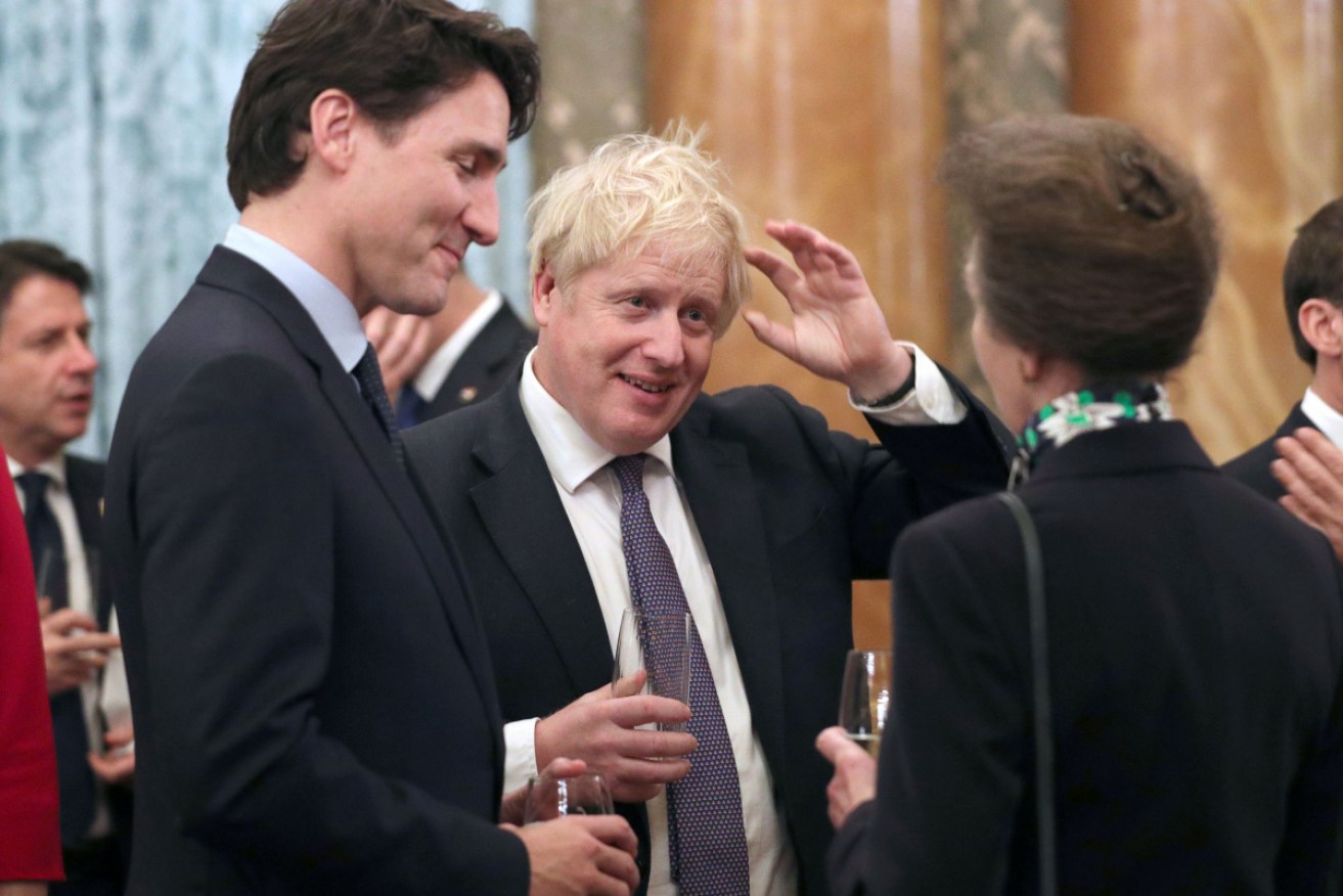 Canadian PM Justin Trudeau with British PM Boris Johnson and Princess Anne at the Buckingham Palace reception.