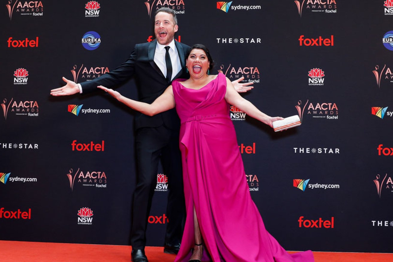 Winners Hamish Blake and Deborah Mailman horse around at the AACTA Awards at The Star in Sydney on Dec. 4.