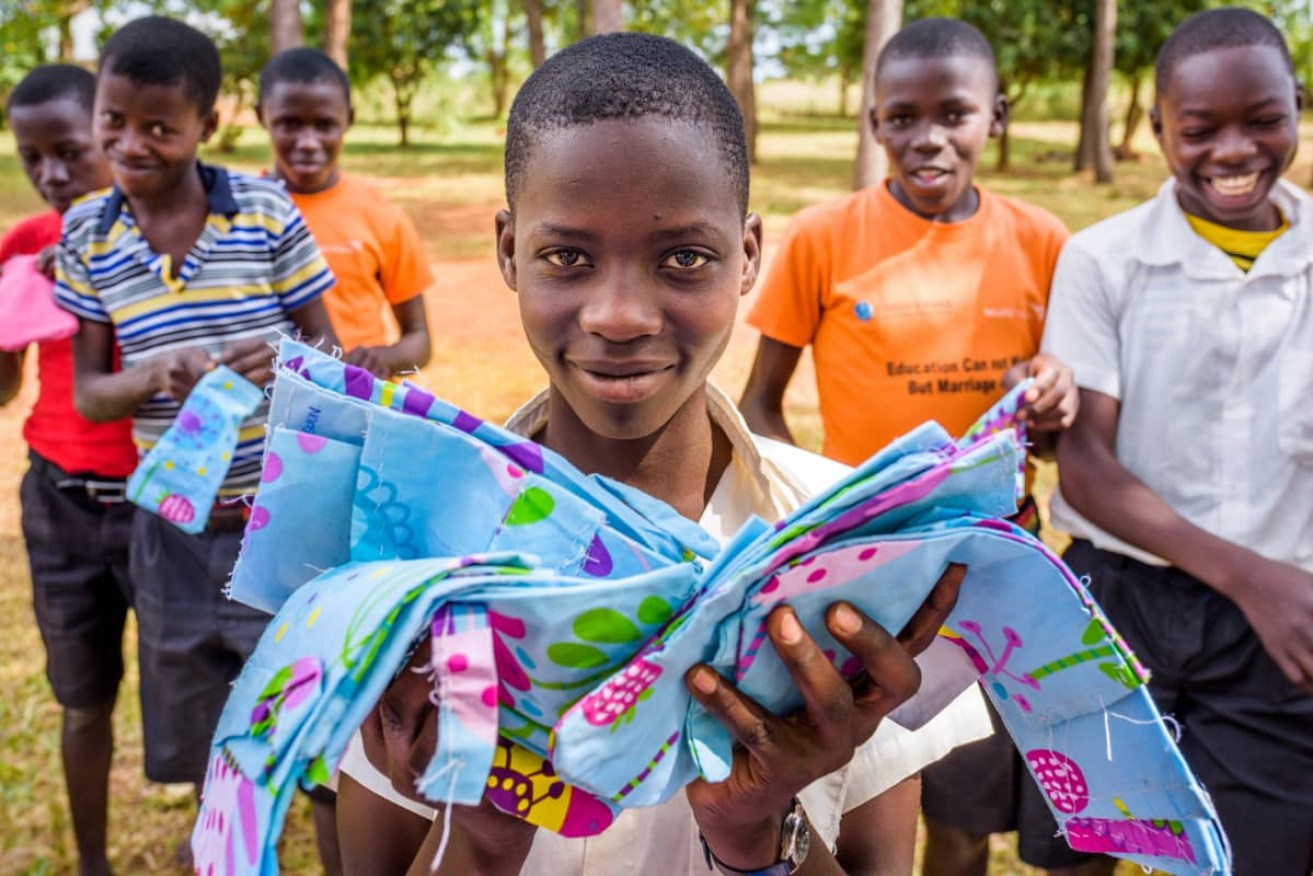 Ugandan schoolboys learn how to make reusable pads for their female school mates.