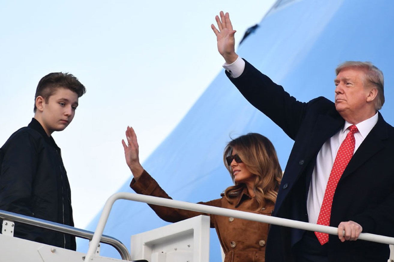 Barron Trump baords Air Force One with parents Melania and Donald Trump on November 26.