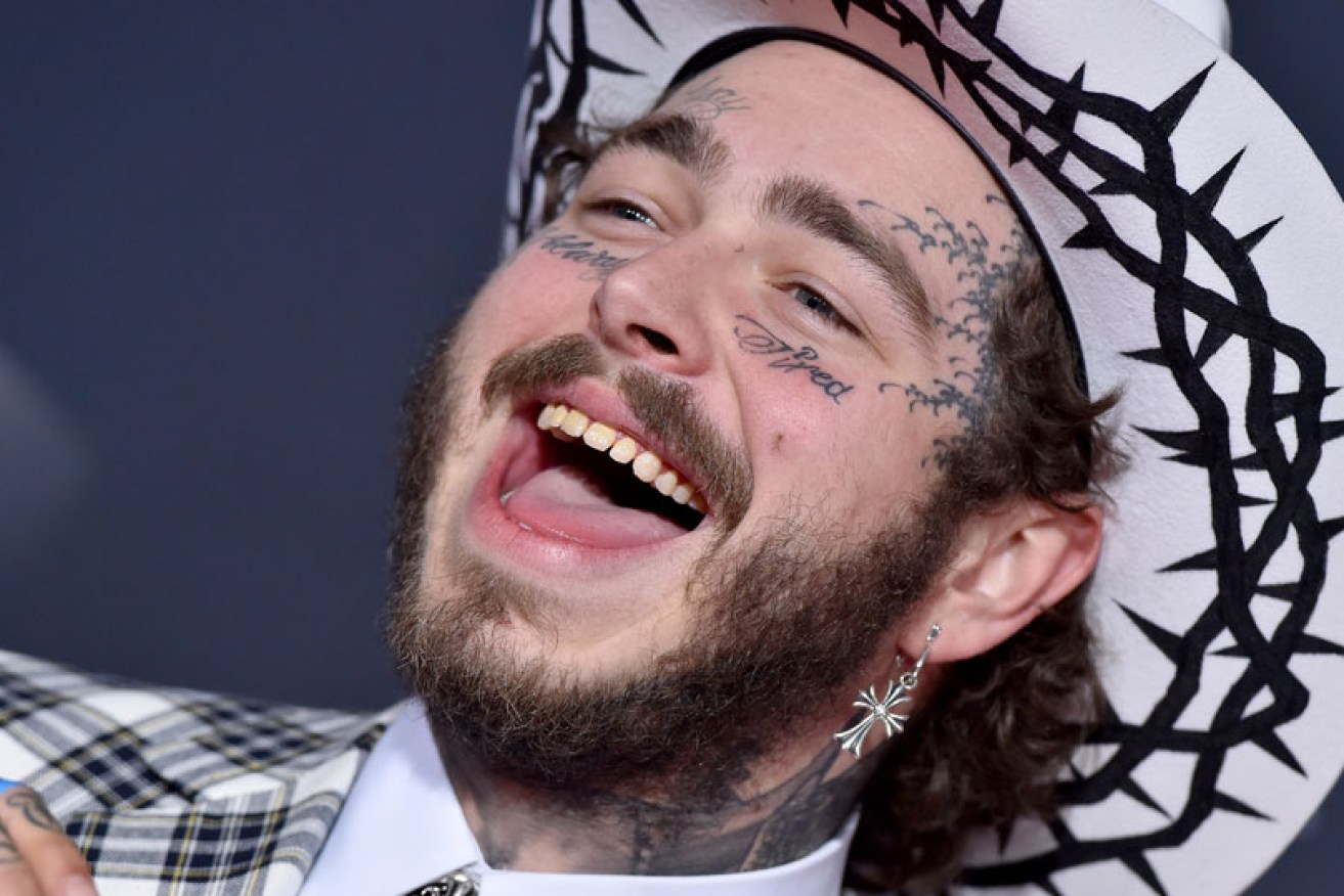 He should be happy: Post Malone at the American Music Awards on November 24 in Los Angeles.