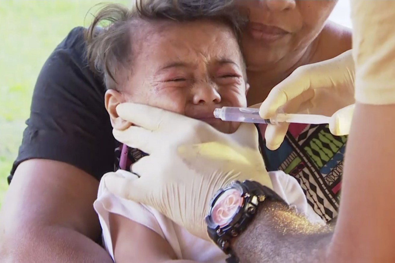 A child is vaccinated at a clinic in the Samoan capital, Apia, in November.