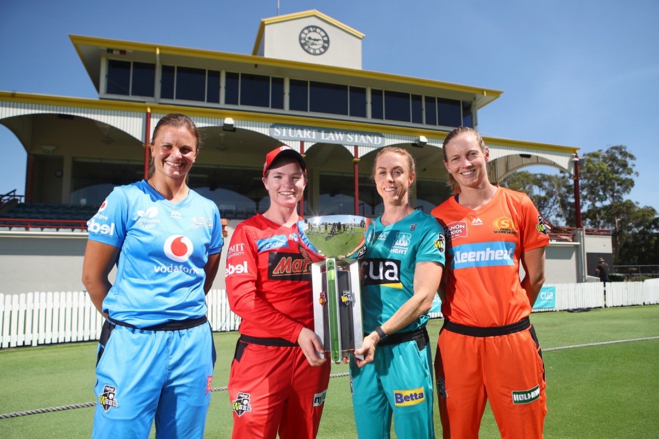 Up for grabs: Adelaide Strikers' Suzie Bates, Melbourne Renegades' Jess Duffin, Brisbane Heat's Kirby Short, and Perth Scorchers' Meg Lanning with the WBBL trophy.  