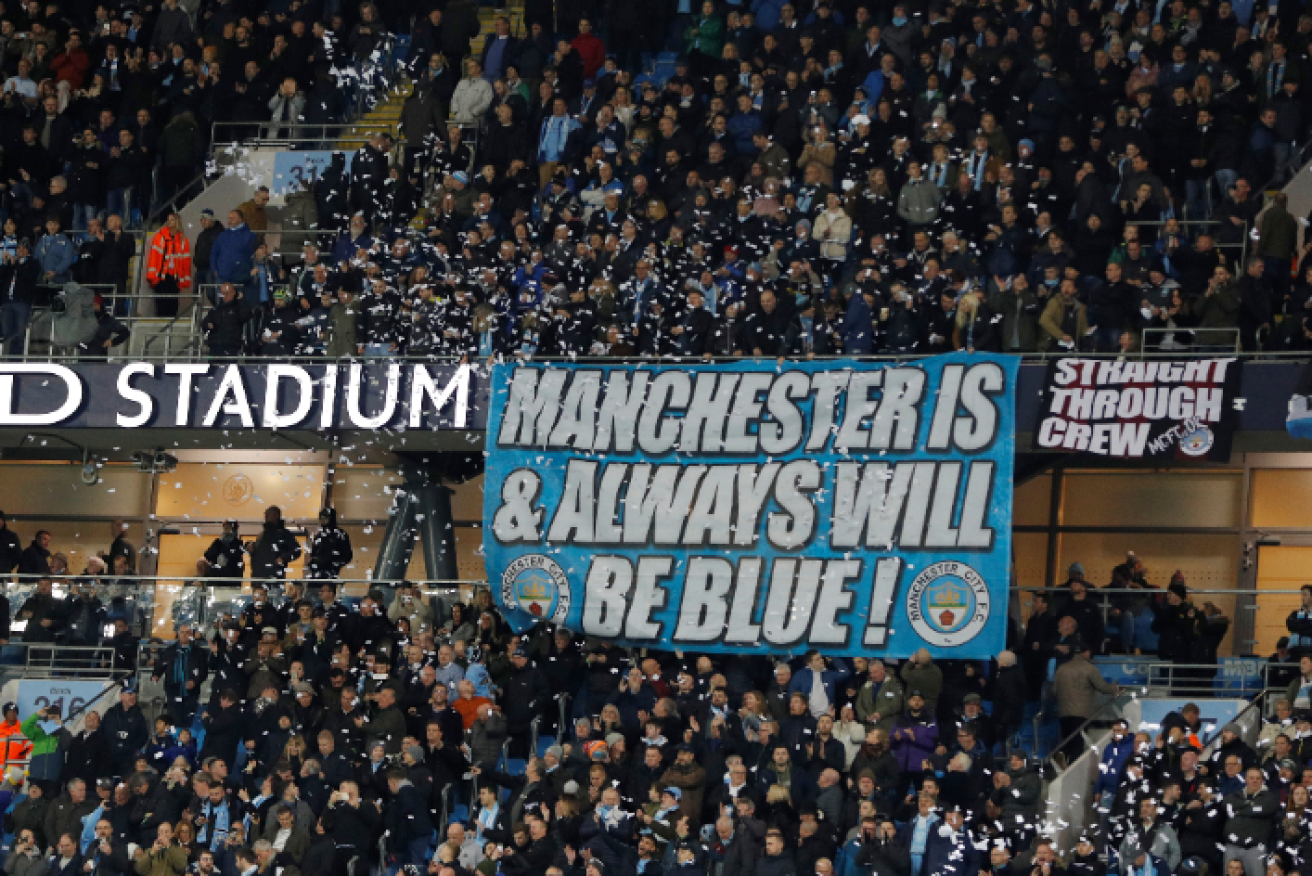 Manchester City supporters proclaim their loyalty before the ugly incident erupted.